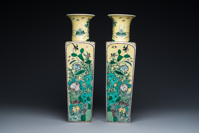 A pair of Chinese square yellow-ground famille verte vases, Kangxi mark, 19th C.