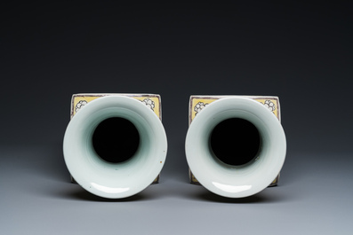 A pair of Chinese square yellow-ground famille verte vases, Kangxi mark, 19th C.