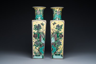 A pair of Chinese square yellow-ground famille verte vases, Kangxi mark, 19th C.