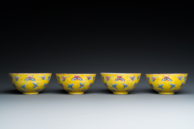 Four Chinese famille rose yellow-ground 'butterfly' bowls, Tongzhi mark and of the period