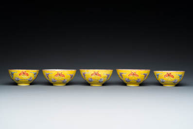 Five Chinese famille rose yellow-ground 'butterfly' bowls, Tongzhi mark and of the period