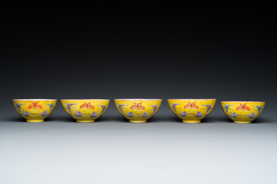 Five Chinese famille rose yellow-ground 'butterfly' bowls, Tongzhi mark and of the period