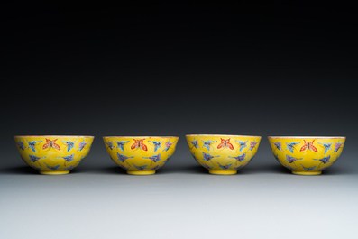Four Chinese famille rose yellow-ground 'butterfly' bowls, Tongzhi mark and of the period