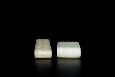 Two fine Chinese white and celadon jade brush rests, Qing