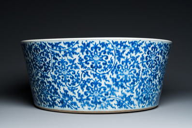 An exceptionally large Chinese blue and white basin with floral scrolls, Kangxi