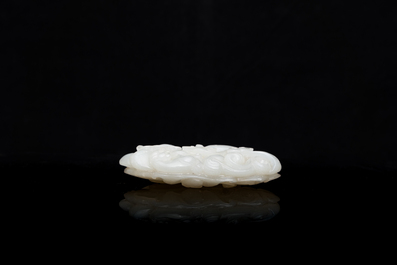 A Chinese white jade paper weight with a crane and a tiger, 17/18th C.