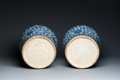 A pair of large Chinese blue and white 'lotus scroll' vases and covers, 19th C.