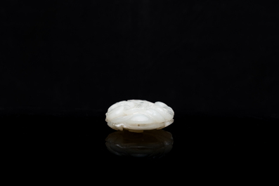 A Chinese white jade paper weight with a crane and a tiger, 17/18th C.