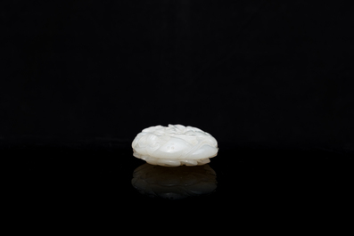 A Chinese white jade paper weight with a crane and a tiger, 17/18th C.