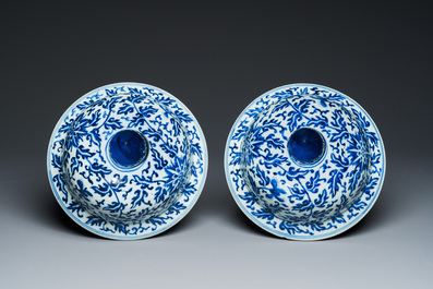 A pair of large Chinese blue and white 'lotus scroll' vases and covers, 19th C.