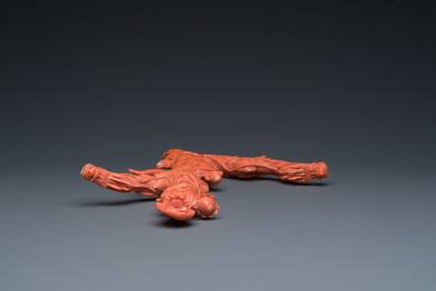 A Chinese red coral figure of a standing Bodhisattva with two dragons, 19/20th C.