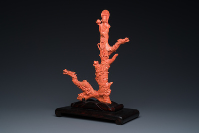 A Chinese red coral figure of a standing Bodhisattva with two dragons, 19/20th C.