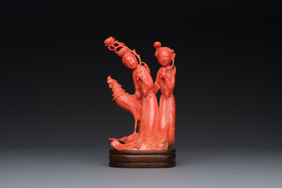 A Chinese red coral group of two ladies and a phoenix, 19/20th C.
