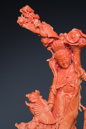A large Chinese red coral group of a lady holding a cornucopia surrounded by children, 19/20th C.