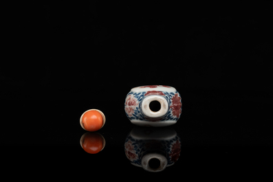 A Chinese blue, white and copper-red snuff bottle, Yongzheng mark and of the period