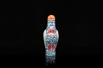 A Chinese blue, white and copper-red snuff bottle, Yongzheng mark and of the period