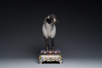 A Chinese cloisonn&eacute; model of a sheep standing on a rectangular base with Arabic inscription, Qing