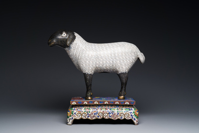 A Chinese cloisonn&eacute; model of a sheep standing on a rectangular base with Arabic inscription, Qing