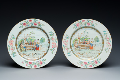 A pair of Chinese famille rose plates with peasants playing cards in the style of the painter David Teniers II, Qianlong