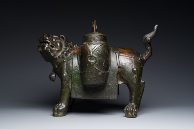 A large Chinese bronze 'touhu' or arrow vase in the shape of a lion, Ming