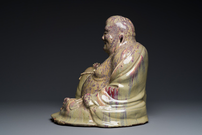 A massive Chinese flamb&eacute;-glazed Shiwan pottery figure of Buddha, 18/19th C.