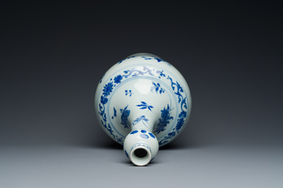 A Chinese blue and white bottle vase with floral designs, Transitional period