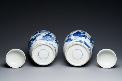 A pair of large Chinese blue and white jars and covers with ladies playing a game of go, 19th C.