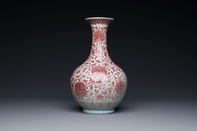 A Chinese copper-red bottle vase with floral scrolls, Qianlong