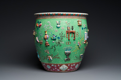 A Chinese famille rose green sgraffito-ground 'antiquities' fish bowl, 19th C.