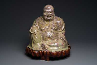 A massive Chinese flamb&eacute;-glazed Shiwan pottery figure of Buddha, 18/19th C.