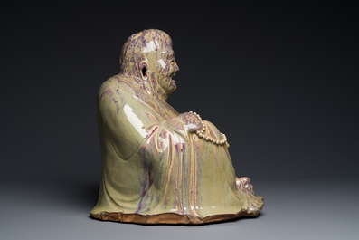 A massive Chinese flamb&eacute;-glazed Shiwan pottery figure of Buddha, 18/19th C.