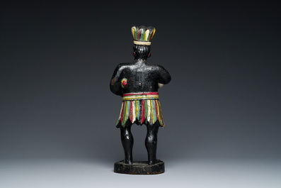 An English polychromed wood sculpture of a pipe-smoking Indian from a tobacco store, 18th C.