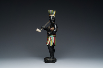 An English polychromed wood sculpture of a pipe-smoking Indian from a tobacco store, 18th C.