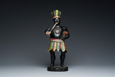 An English polychromed wood sculpture of a pipe-smoking Indian from a tobacco store, 18th C.