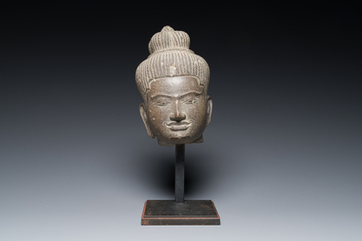 A Khmer polished sandstone head of Uma in Baphuon-style, Angkor period, Cambodia, 11th C.