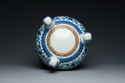 A large Chinese blue and white 'bajixiang' tripod censer with lotus scrolls, Qianlong