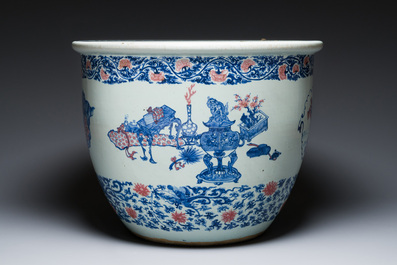 An exceptional massive Chinese blue, white and copper-red fish bowl with antiquities and 'Master of the rocks'-style panels, Kangxi