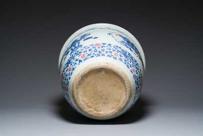 An exceptional massive Chinese blue, white and copper-red fish bowl with antiquities and 'Master of the rocks'-style panels, Kangxi