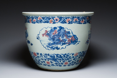 An exceptional massive Chinese blue, white and copper-red fish bowl with antiquities and 'Master of the rocks'-style panels, Kangxi