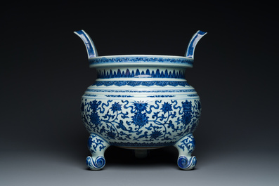 A large Chinese blue and white 'bajixiang' tripod censer with lotus scrolls, Qianlong