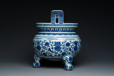 A large Chinese blue and white 'bajixiang' tripod censer with lotus scrolls, Qianlong