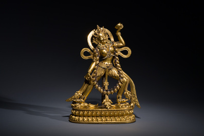A Tibetan gilt bronze sculpture of Sarvabuddha Dakini, probably 15th C.