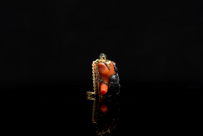A rare Japanese gold and silver pendant with three South Sea-islanders on a coral branch, Meiji, 19th C.