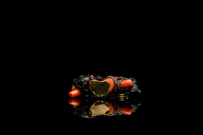 A rare Japanese gold and silver pendant with three South Sea-islanders on a coral branch, Meiji, 19th C.