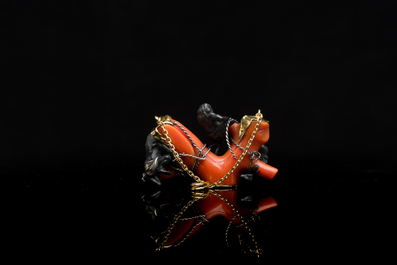 A rare Japanese gold and silver pendant with three South Sea-islanders on a coral branch, Meiji, 19th C.