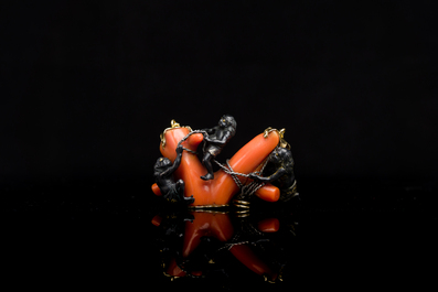 A rare Japanese gold and silver pendant with three South Sea-islanders on a coral branch, Meiji, 19th C.