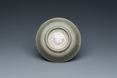 A Chinese celadon-glazed bottle vase and two bowls, Yuan/Ming