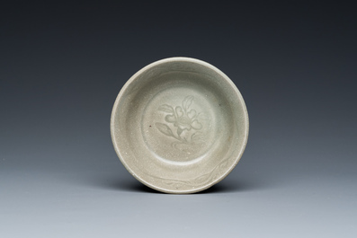 A Chinese celadon-glazed bottle vase and two bowls, Yuan/Ming