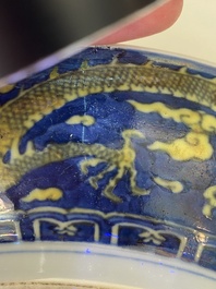 A Chinese blue-ground yellow-enamelled 'dragon' dish, Qianlong mark and of the period