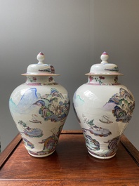 A pair of Chinese famille rose vases and covers with mountainous river landscapes, Yongzheng